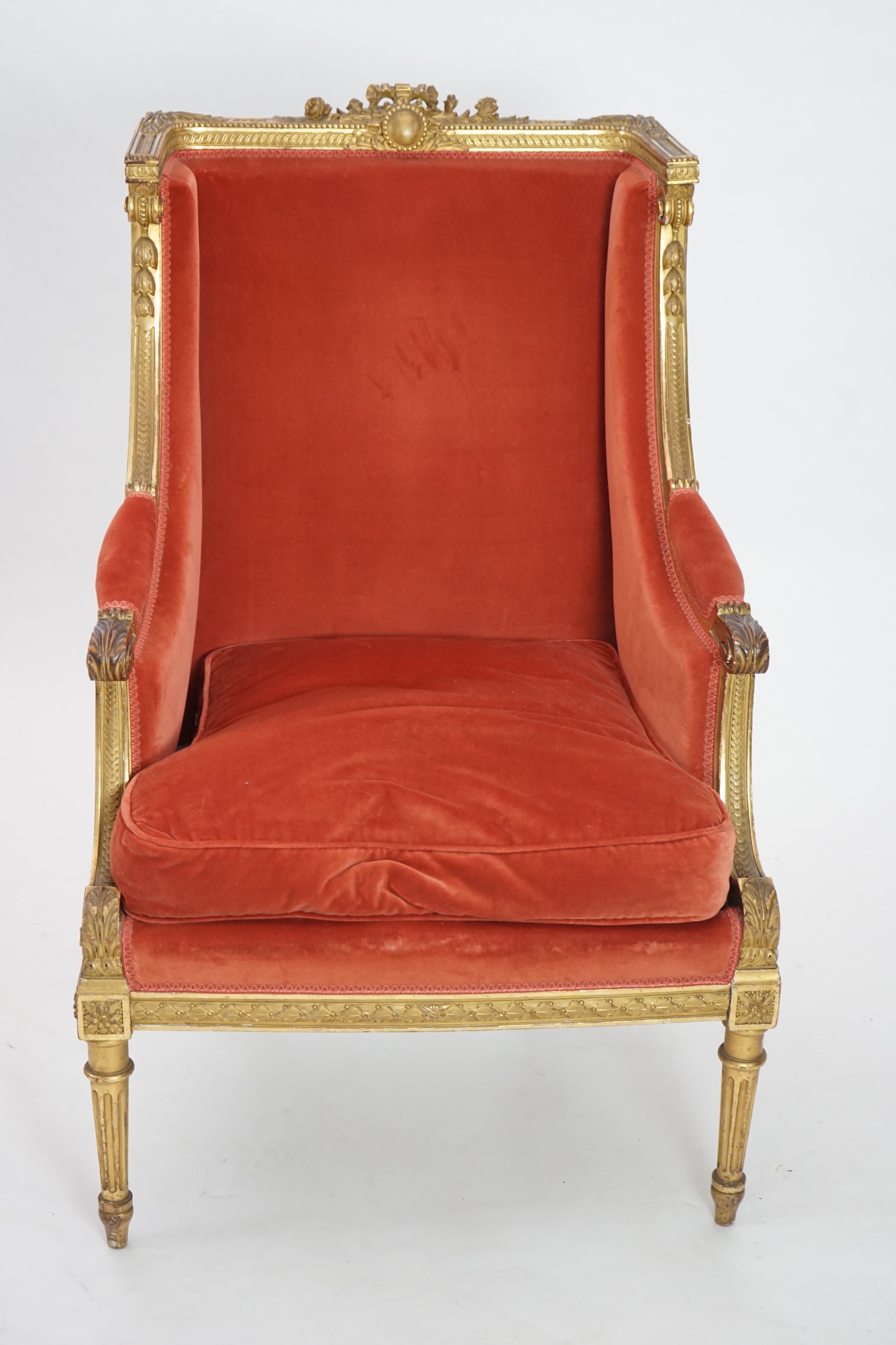 A Louis XVI style carved giltwood fauteuil, circa 1900